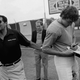 Joe Paterno tries to pull Todd Blackledge away from signing autographs in 1982. Jack Thornell/AP Images